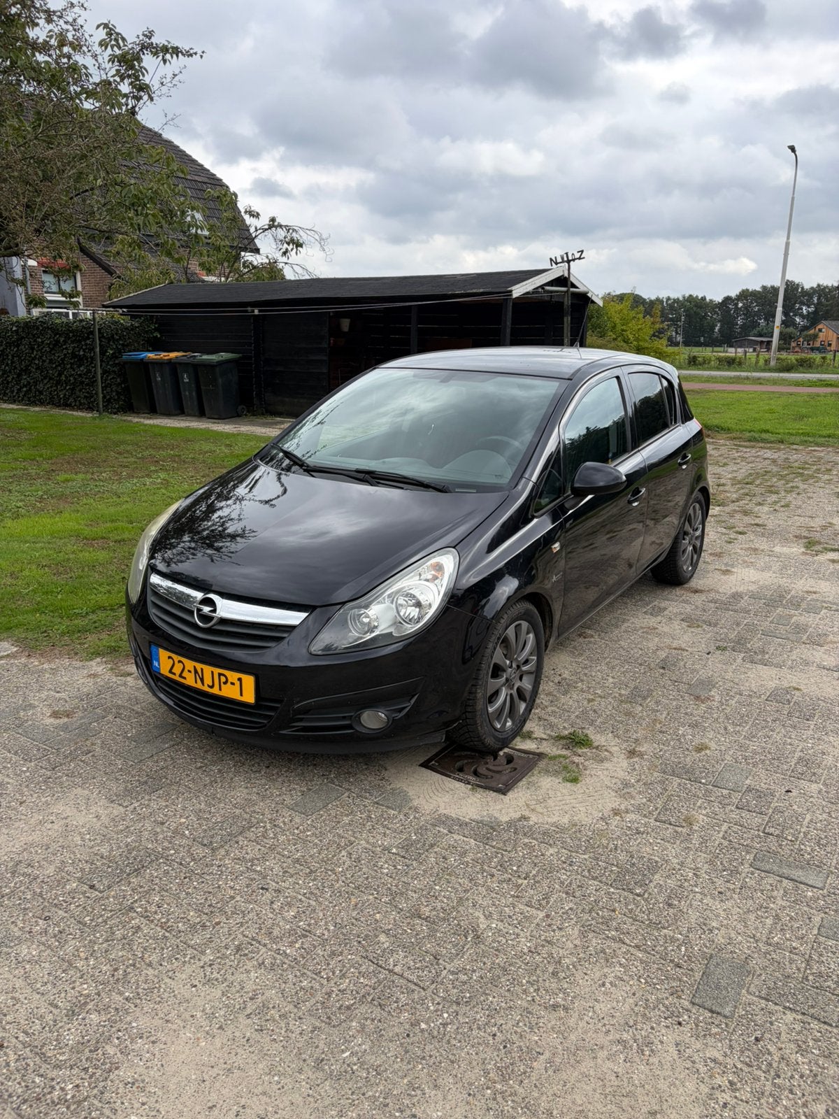 Opel Corsa 1.2 Twinport 86pk 5d 2010 Zwart, Auto's, Voorwielaandrijving, 4 cilinders, 1229 cc, Origineel Nederlands