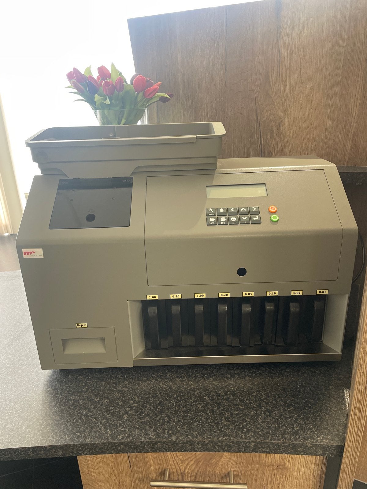 Professionele muntentelsorteermachine, Ophalen