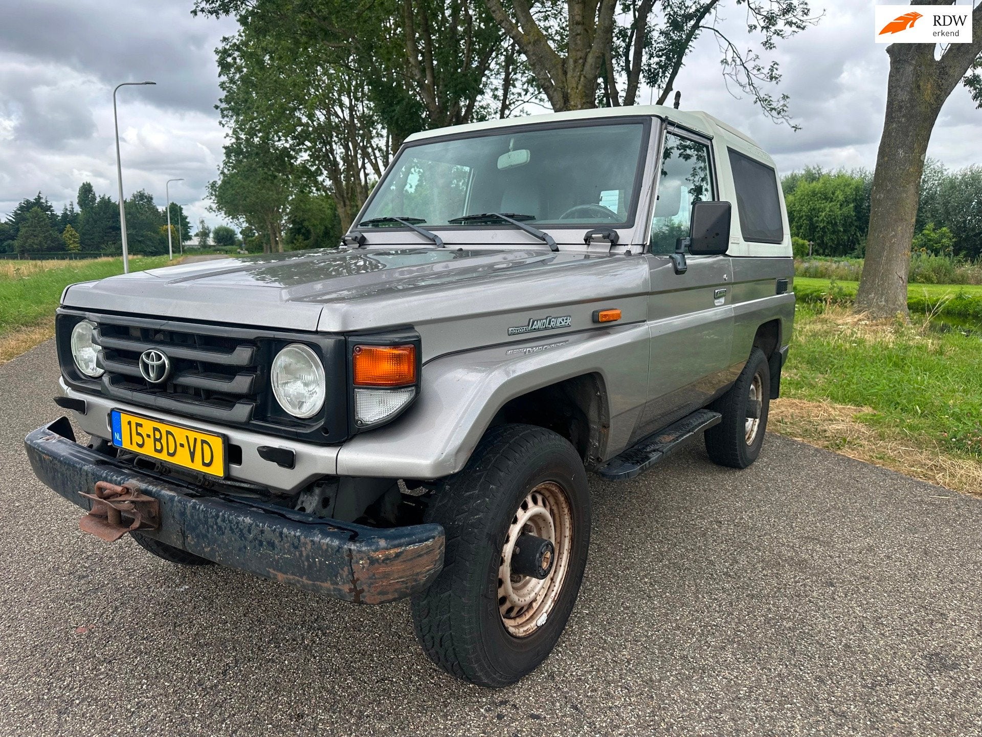 Toyota LandCruiser 70 4.2 LX Blind Van FRP|unieke km|nw apk, Auto's, Bestelauto's, Stof, Gebruikt, Zwart, 4164 cc