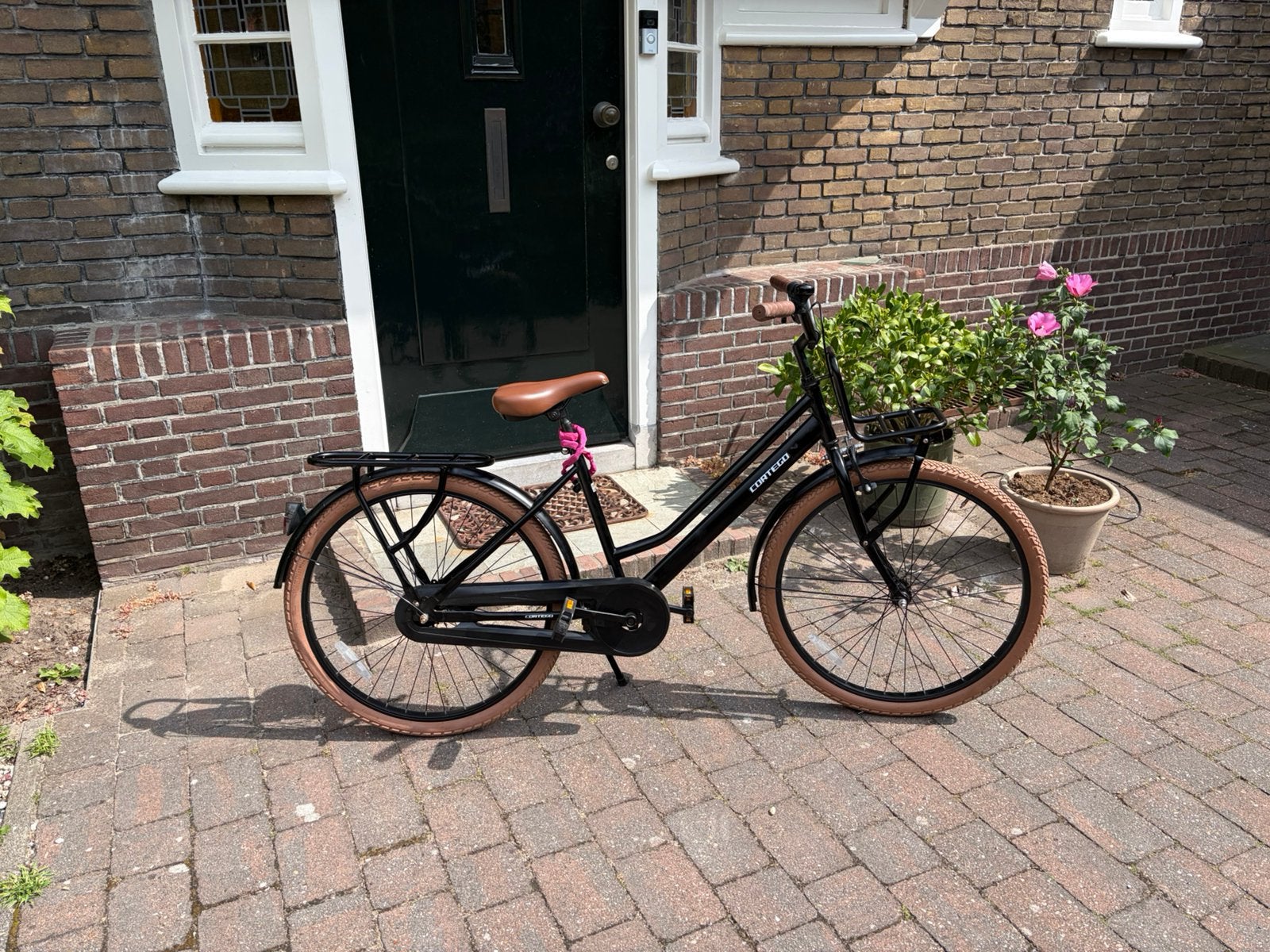 Meisjes transport fiets 26 inch mat zwart Cortega, Ophalen, Gebruikt, Terugtraprem, 26 inch of meer