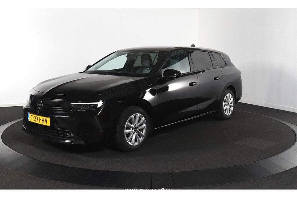 Opel Astra Sports Tourer 1.2 Business Edition (bj 2023), Auto's, Gebruikt, Zwart, Handgeschakeld, 3 cilinders
