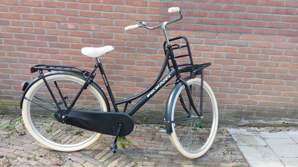 Pelikaan transport fiets terugtraprem, Ophalen