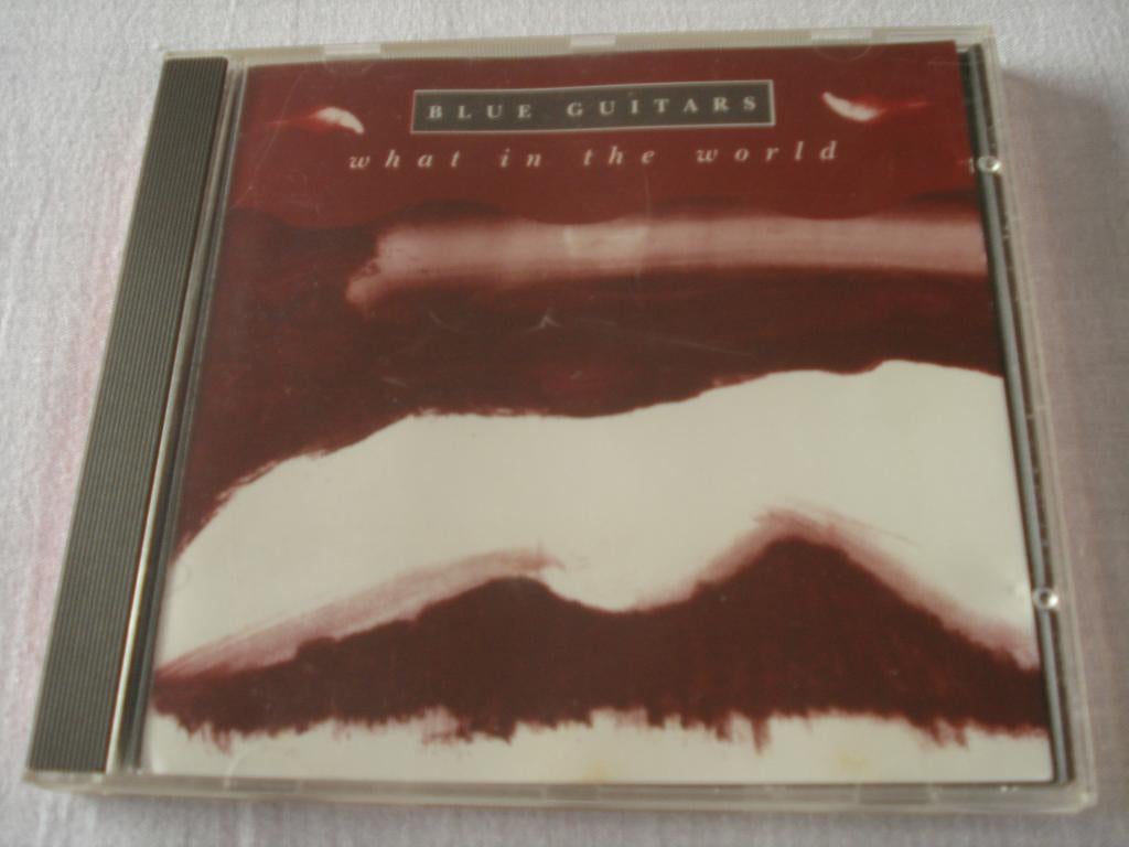 BLUE GUITARS - WHAT IN THE WORLD, Ophalen of Verzenden, Zo goed als nieuw, Poprock