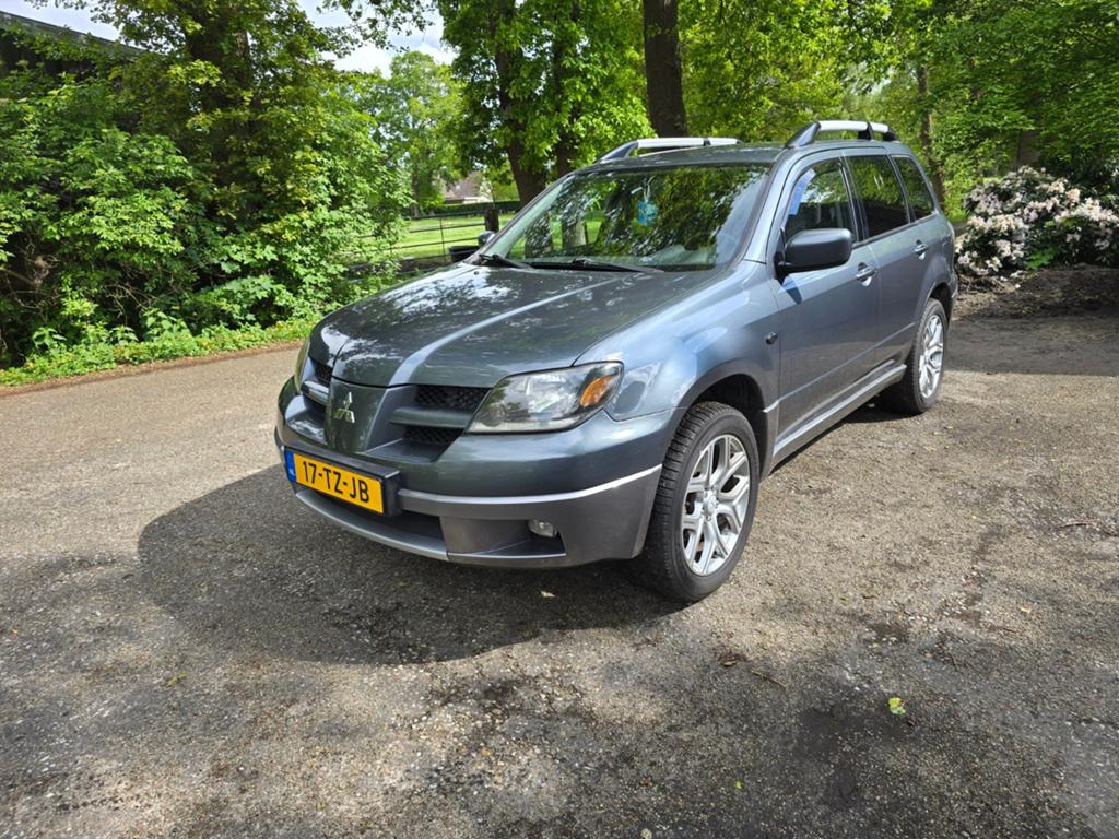 Mitsubishi Outlander 2.4  4WD AUT 2007 Grijs, Auto's, Automaat, Stof, Outlander, 4 cilinders