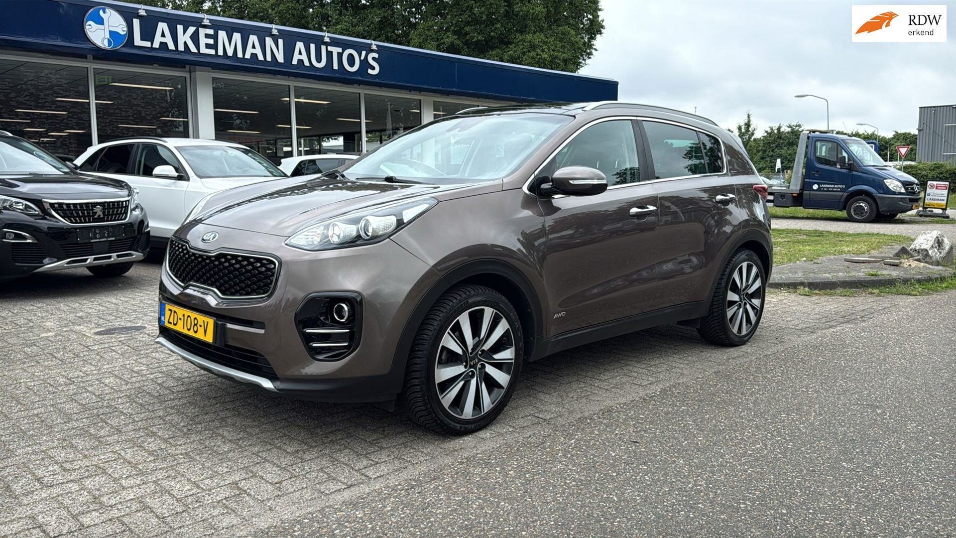 Kia Sportage 1.6 T-GDI 4WD DynamicPlusLine Huurkoop Inruil A, Auto's, Gebruikt, 4 cilinders, Bruin, Bedrijf