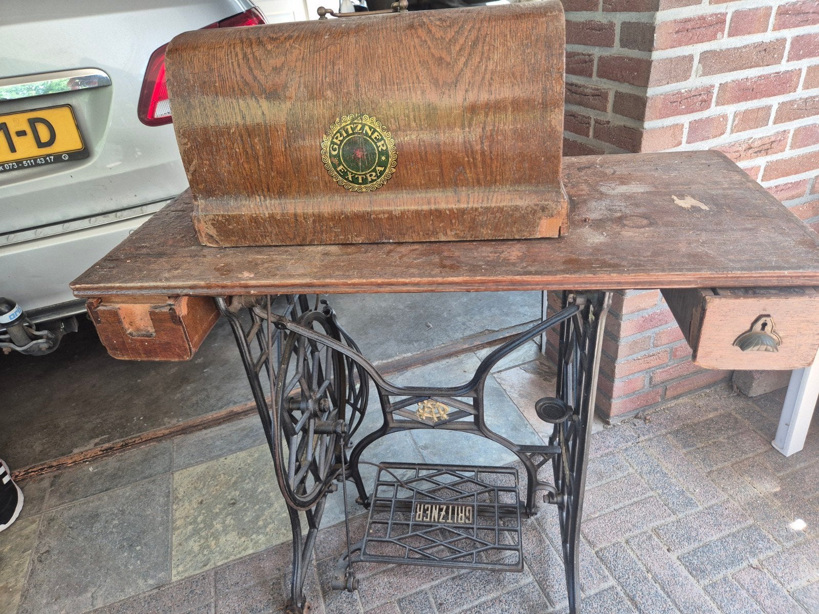 Antieke Gritzner naaimachine met houten tafel en kap, Ophalen of Verzenden