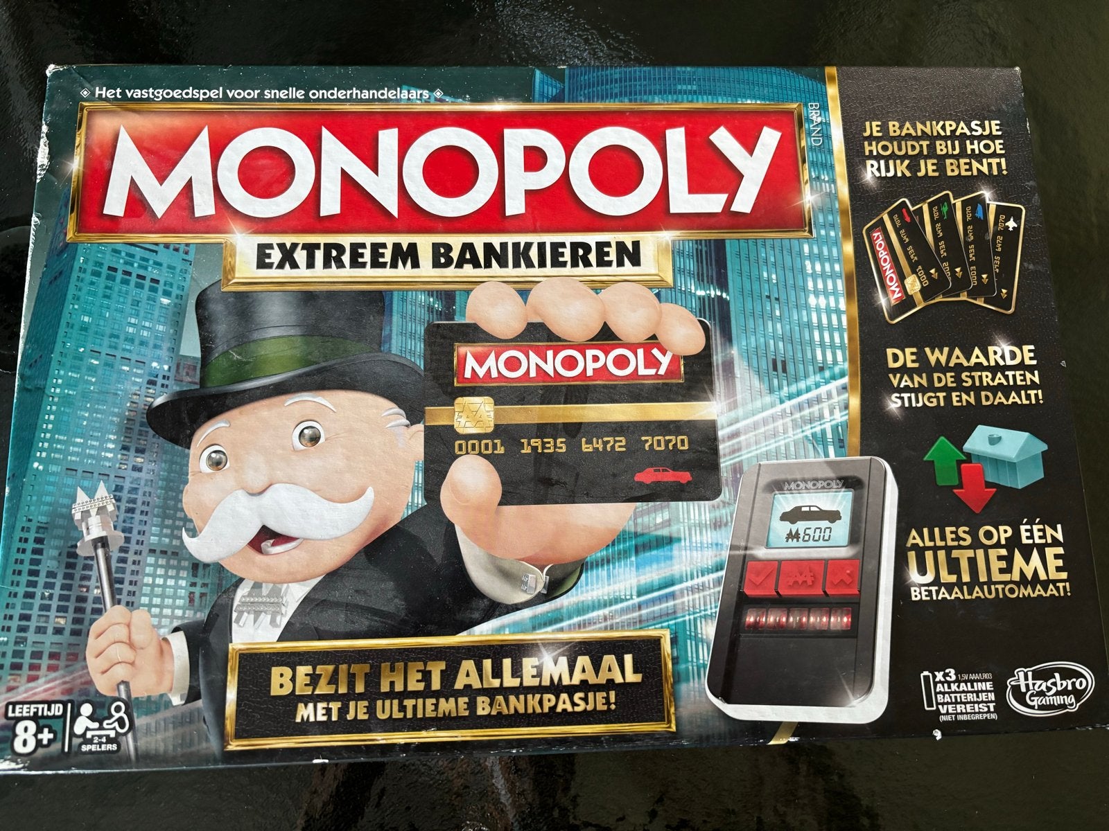Monopoly Extreem Bankieren bordspel Bezit het allemaal!, Drie of vier spelers, Ophalen of Verzenden, Zo goed als nieuw