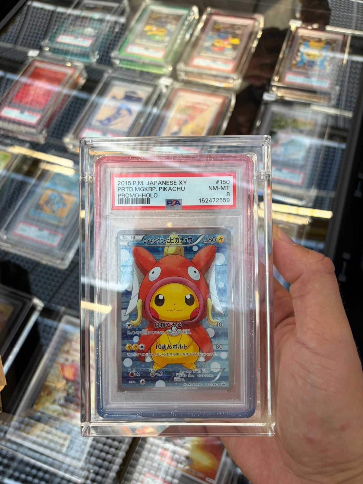 Pokemon Pikachu Magikarp Poncho PSA 8, Ophalen of Verzenden, Zo goed als nieuw