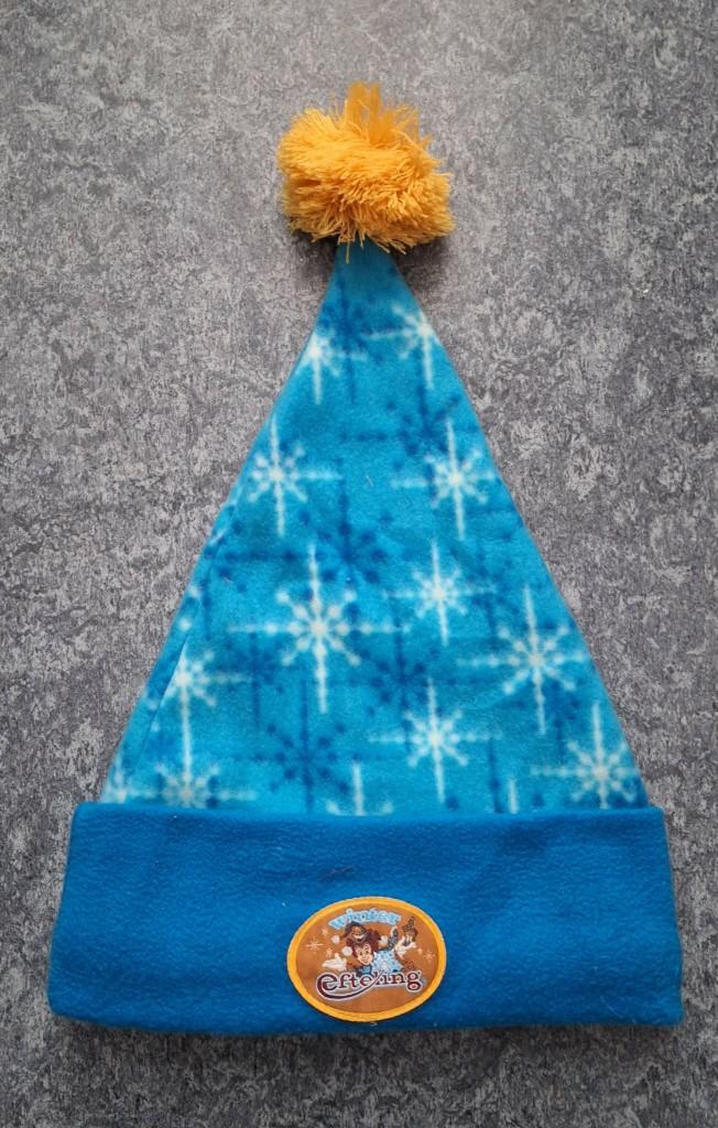 Te koop blauwe fleece muts van de Winter Efteling., Ophalen of Verzenden, Zo goed als nieuw, Kleding