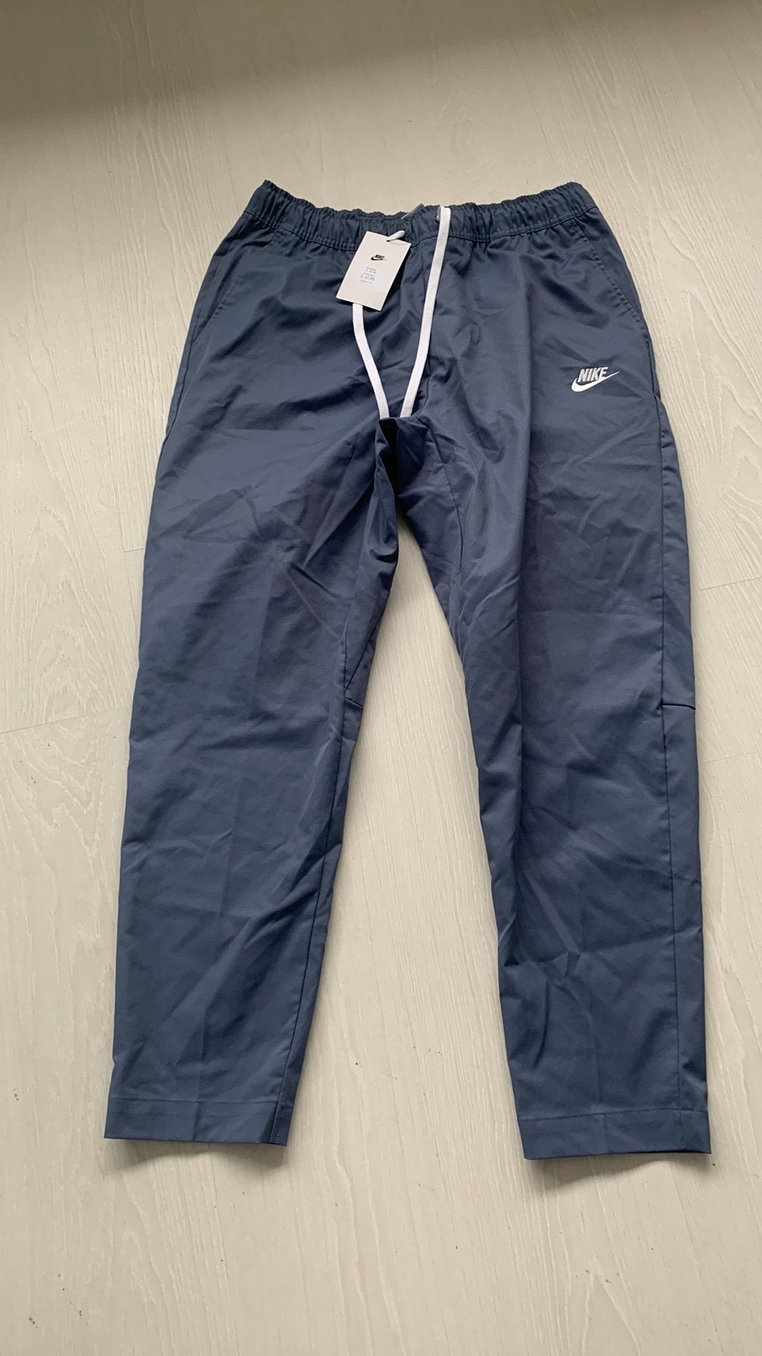 Blauwe dunne nike broek gloednieuw, Maat 52/54 (L), Blauw, Nieuw, Ophalen of Verzenden