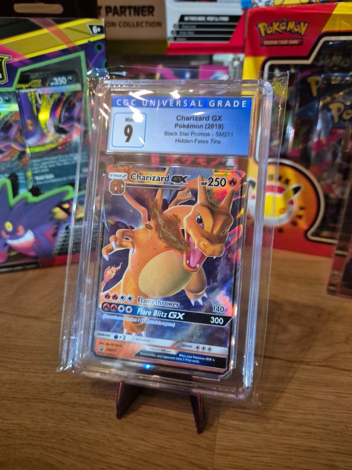 Charizard GX CGC 9 Pokémon Kaart - Black Star Promos SM211, Ophalen of Verzenden, Zo goed als nieuw, Losse kaart