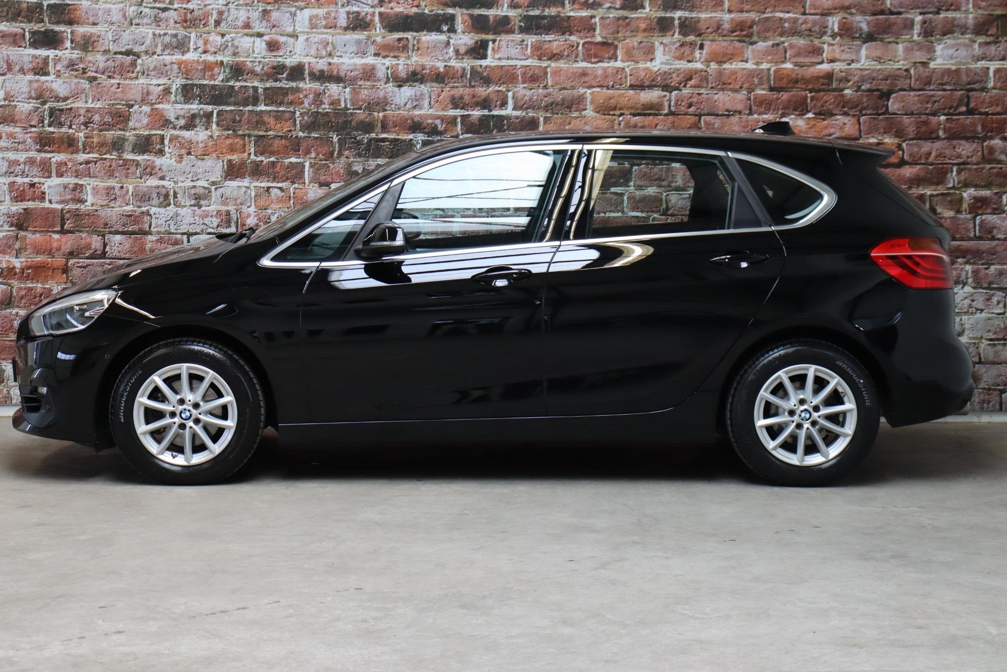 BMW 2-serie Active Tourer 218i Executive Automaat / Navigati, Auto's, Stof, Gebruikt, Euro 6, Automatische klimaatregeling