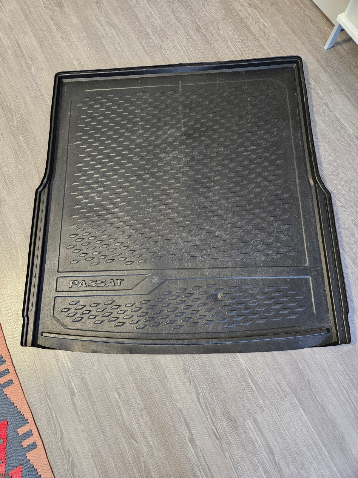 Volkswagen Passat kofferbakmat, Ophalen