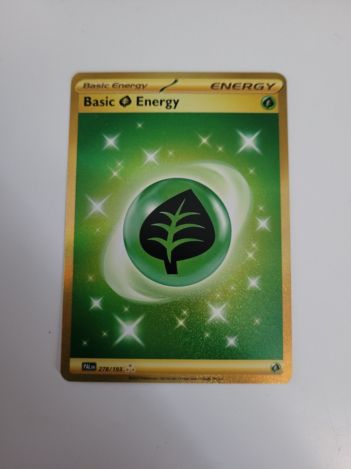 Basic grass energy gold 278/193, Ophalen, Zo goed als nieuw, Losse kaart, Foil