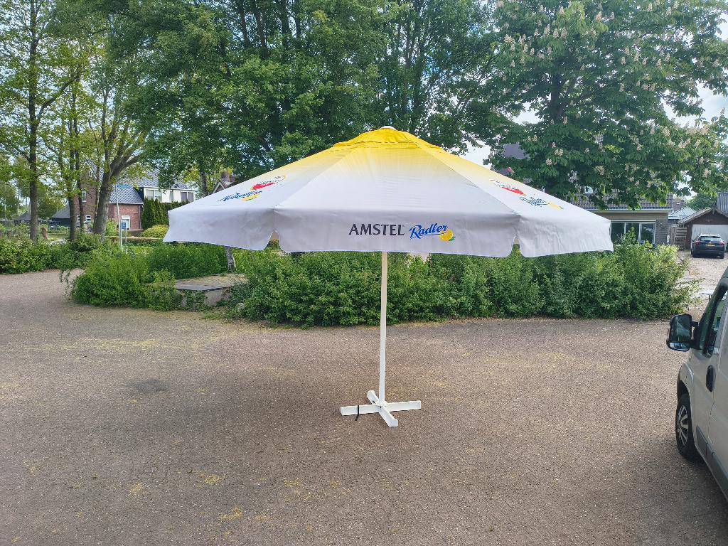 Grote Amstel Radler parasol 5 meter, Tuin en Terras, Ophalen, Nieuw, Meer dan 4 meter, Stokparasol