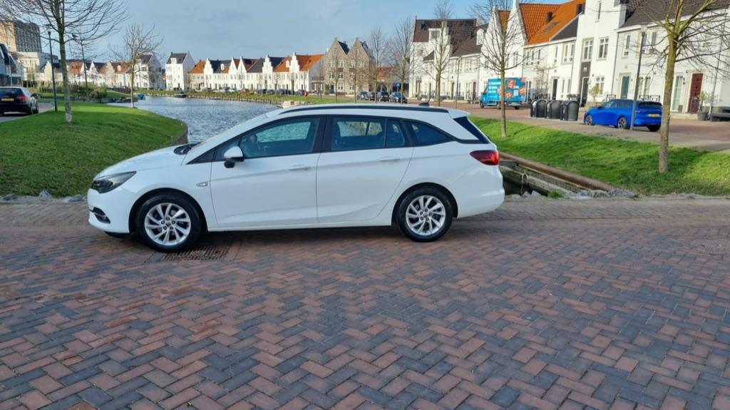 Opel Astra 1.2 Turbo 110pk Start/stop 2020 met nieuwe motor!, Auto's, Opel, Voorwielaandrijving, Stof, 1199 cc, Wit