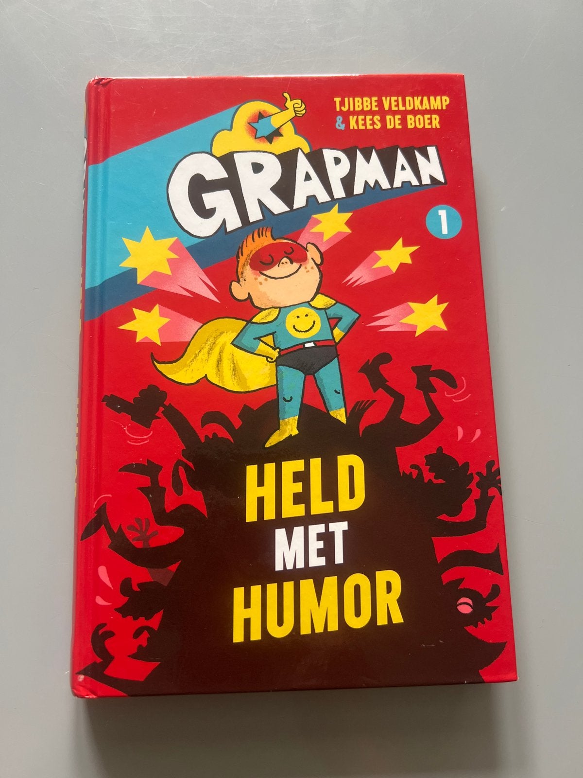 Grapman: Held met Humor - Tjibbe Veldkamp & Kees de Boer, Ophalen of Verzenden, Gelezen, Fictie algemeen