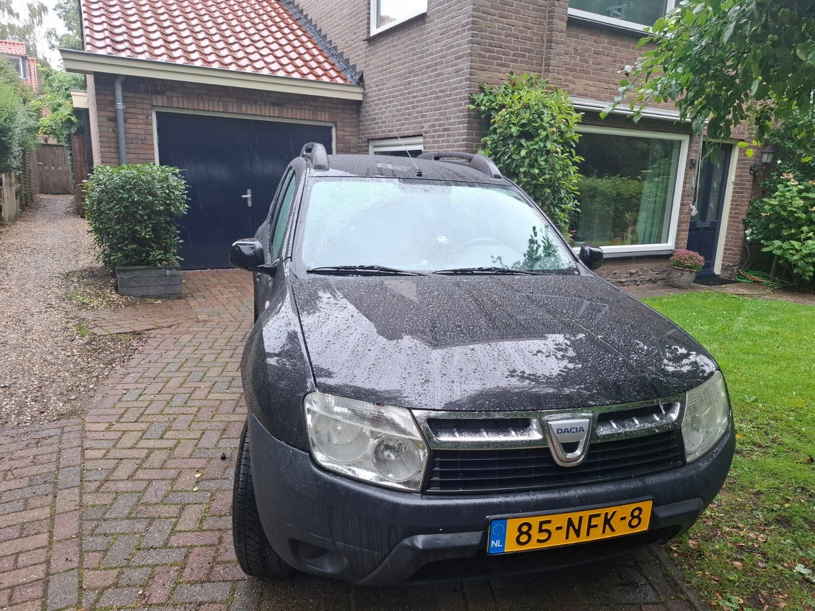 Dacia Duster 1.6  2010 zwart benzine trekhaak airco, Auto's, Stof, 4 cilinders, Duster, 1200 kg