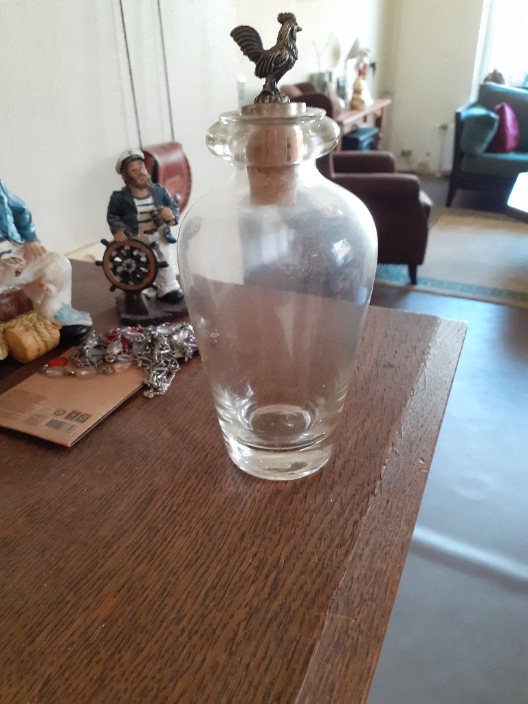 glazen flesje,met een zilveren haantje er op, Ophalen