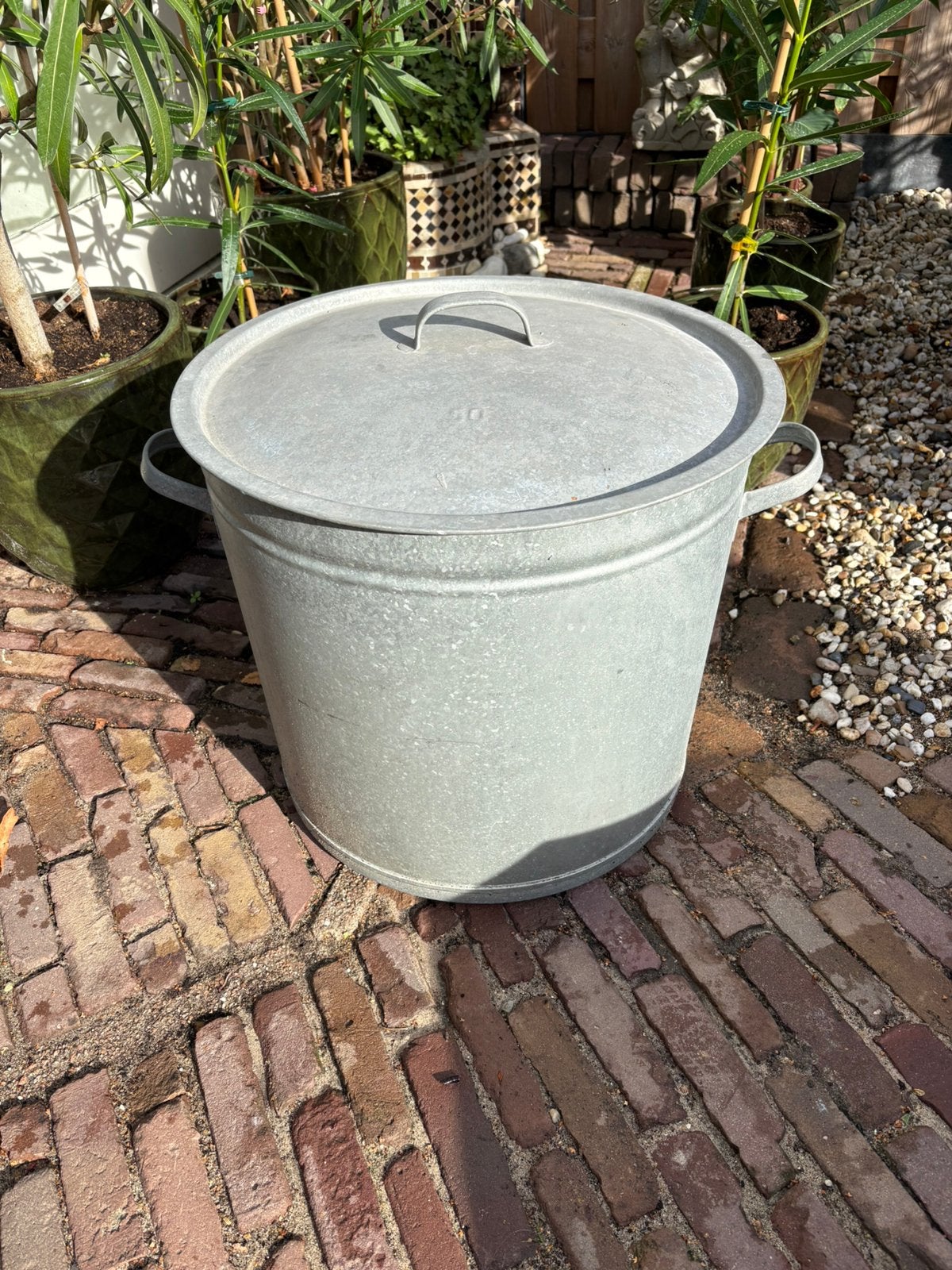 Zinken wasteil 50 liter, Ophalen