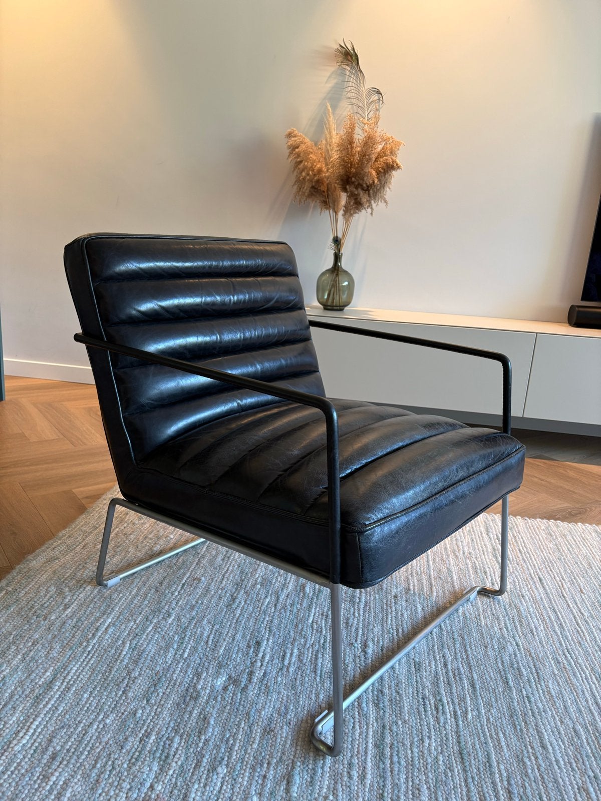 Design fauteuil zwart - Loods5, Huis en Inrichting, Fauteuils, Ophalen, Gebruikt, 50 tot 75 cm, Leer