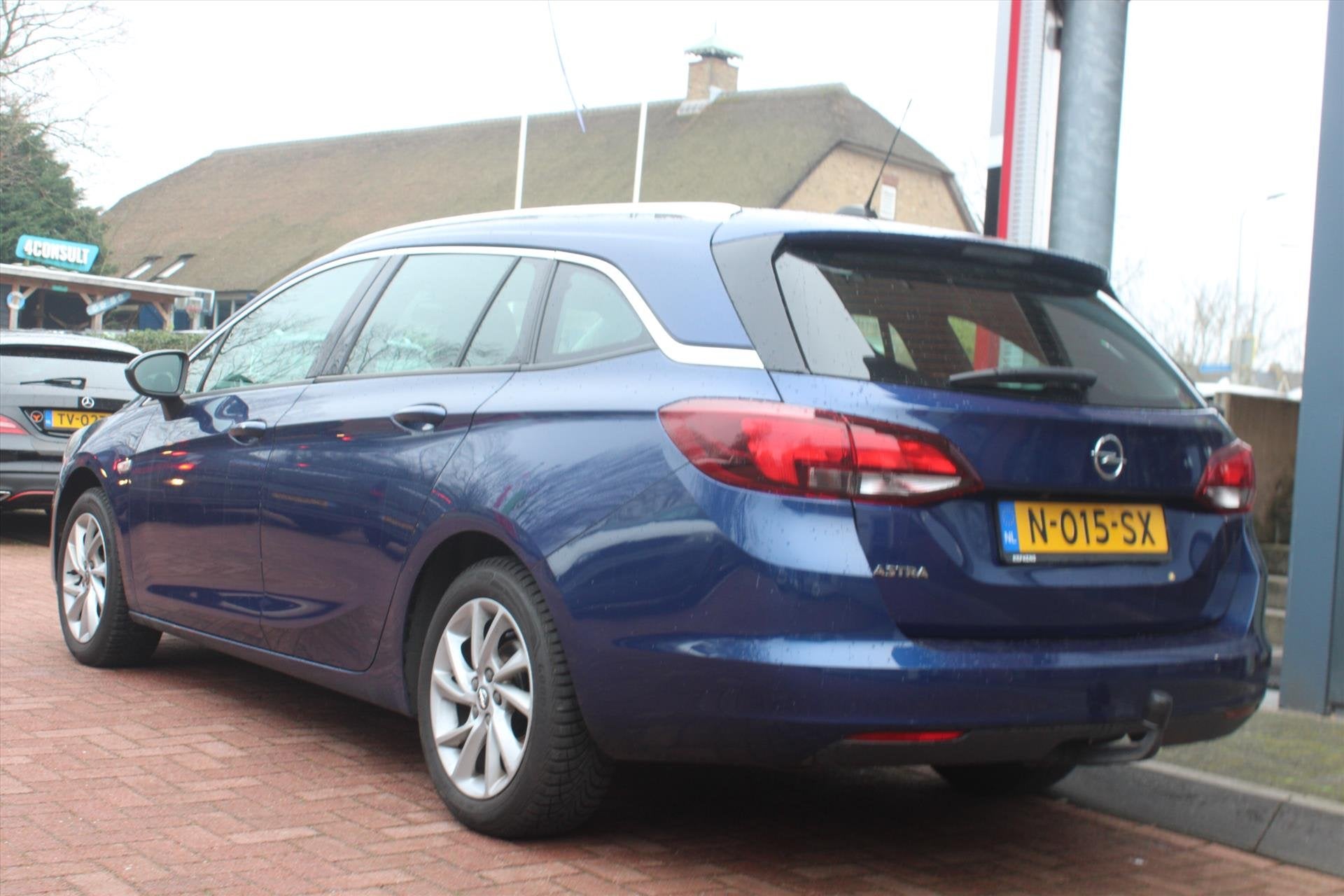 OPEL Astra Sports Tourer 1.4 Turbo Aut. *Business* | Trekhaa, Auto's, Opel, 145 pk, Gebruikt, Blauw, Leder en Stof