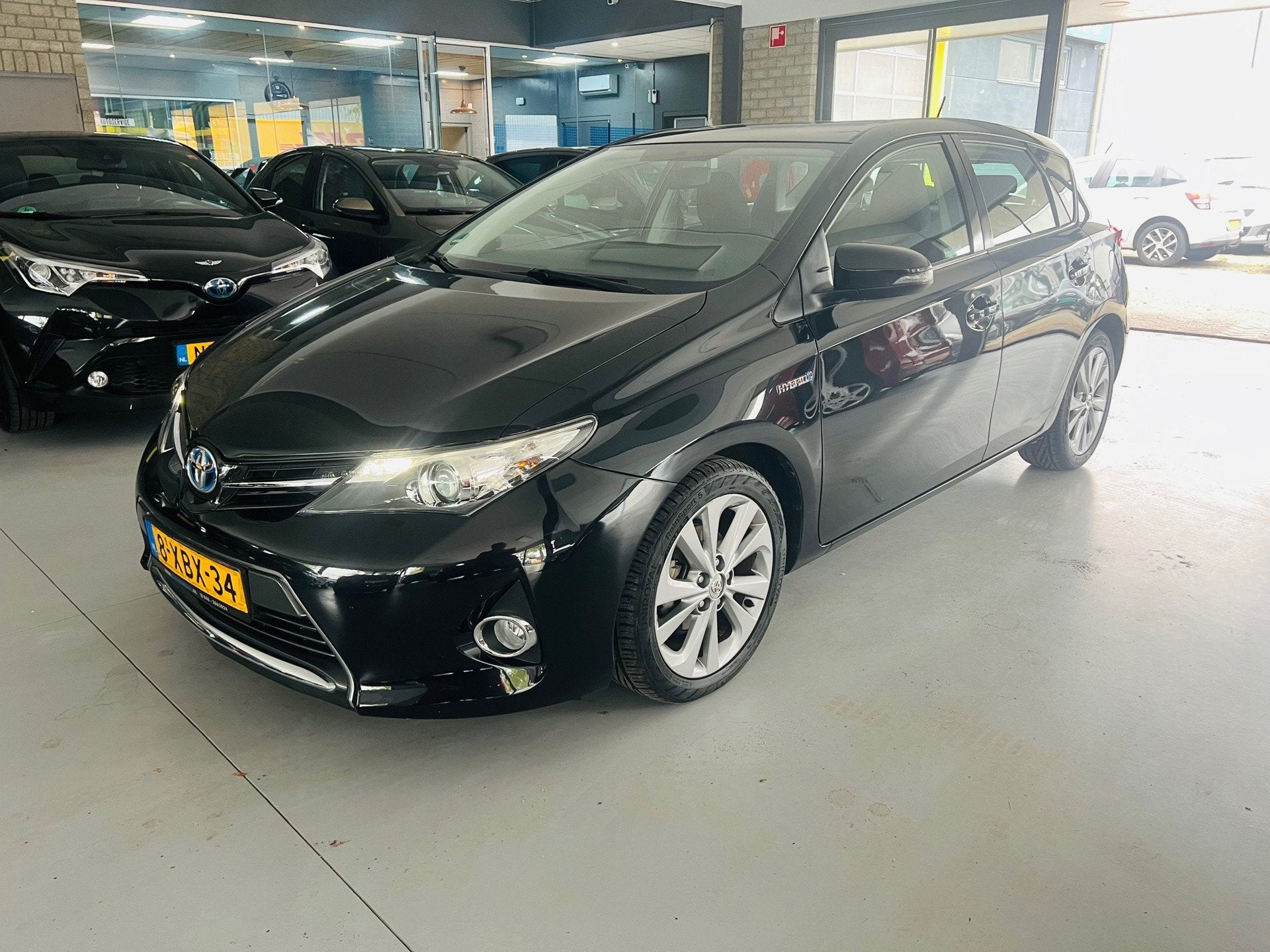 Toyota Auris 1.8 Hybrid Executive, Auto's, Euro 5, Gebruikt, 4 cilinders, Leder en Stof