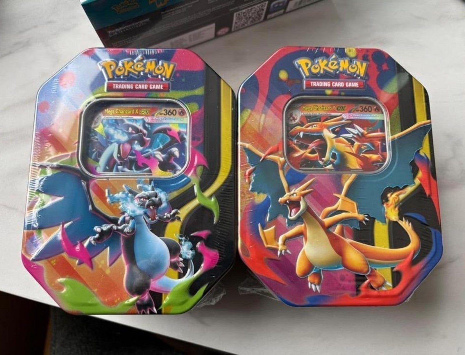 Pokémon TCG Charizard GX Tin Boxen (2 stuks), Ophalen of Verzenden, Nieuw, Overige typen