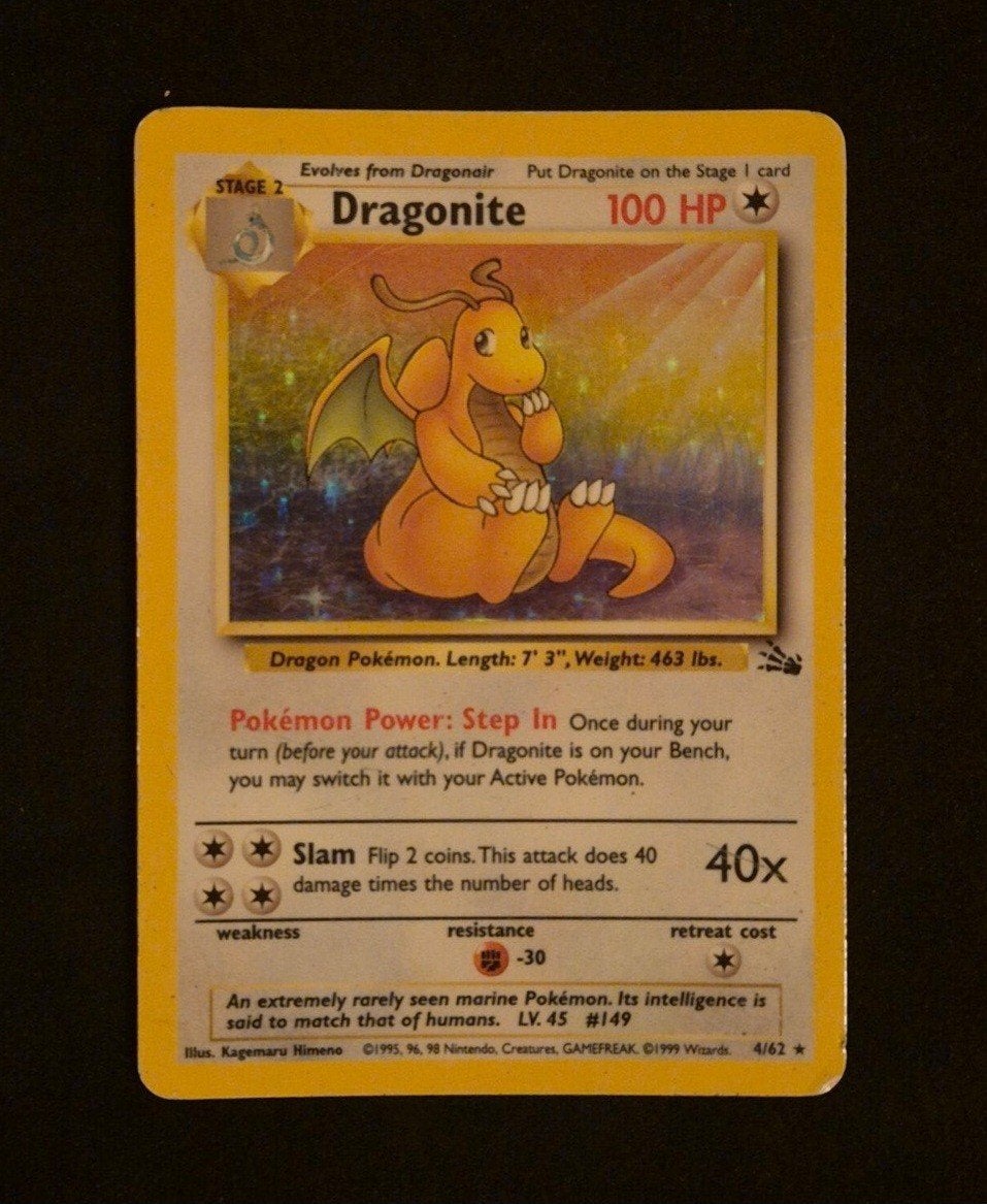 Pokémon Dragonite 4/62 Holo Fossil, Ophalen of Verzenden, Gebruikt, Losse kaart, Foil