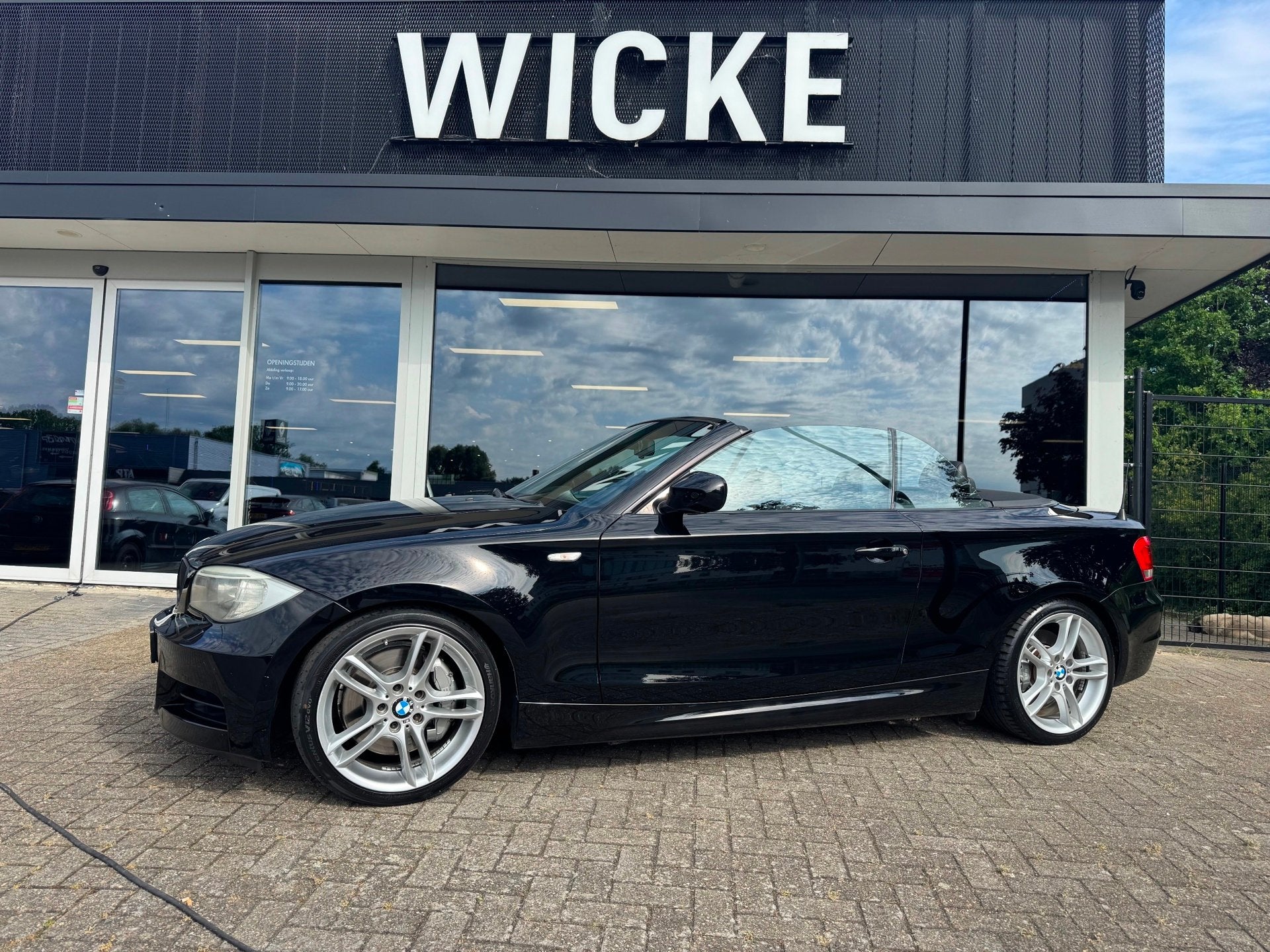 BMW 1-serie M135i xDrive High Executive Cabriolet AUT Leder, Auto's, Euro 5, Gebruikt, Zwart, Cabriolet
