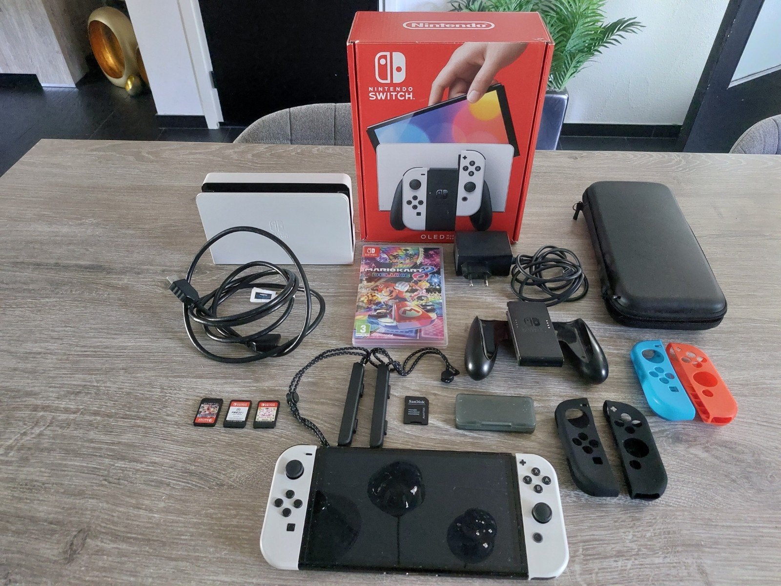 Foto 2 van Nintendo Switch OLED met games en extra controllers