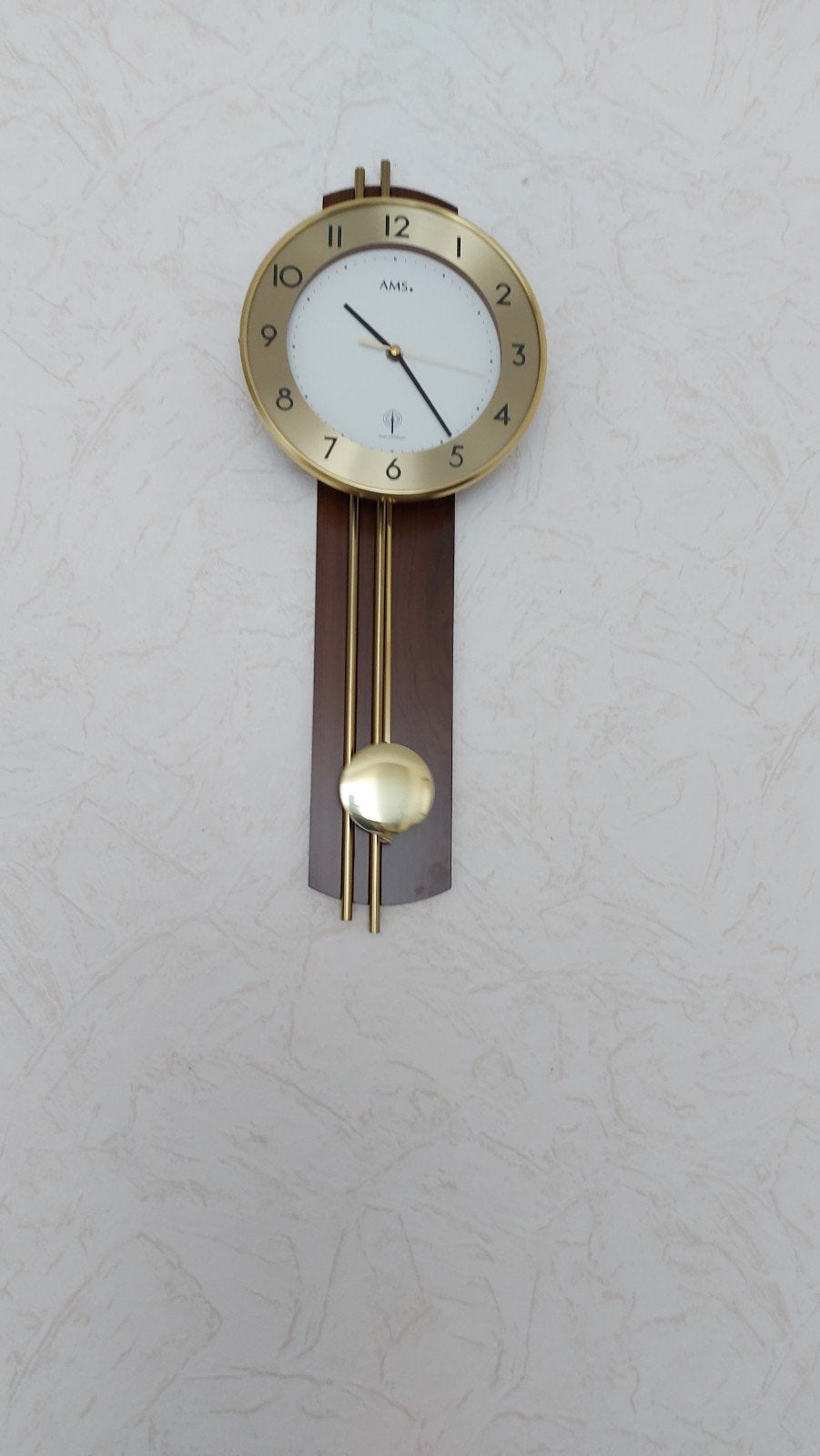 Elegante AMS wandklok met slinger, Ophalen