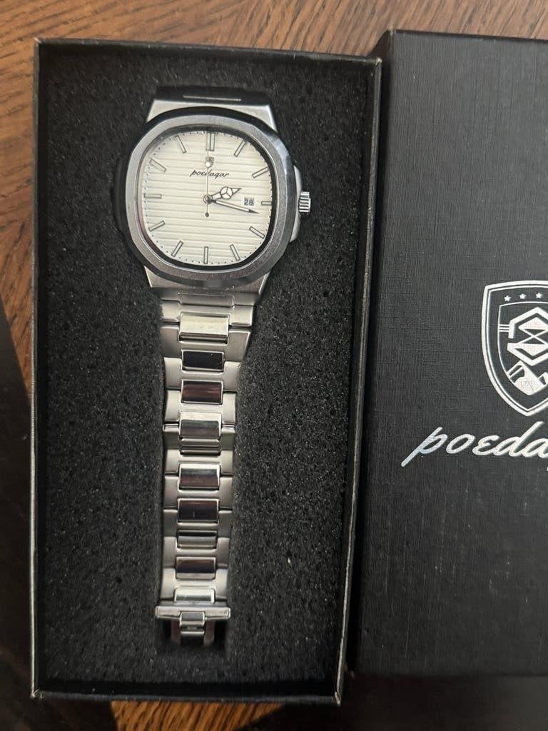 Poedagar - Herenhorloge Nieuw in doos - nooit gedragen., Sieraden, Tassen en Uiterlijk, Ophalen of Verzenden, Zo goed als nieuw