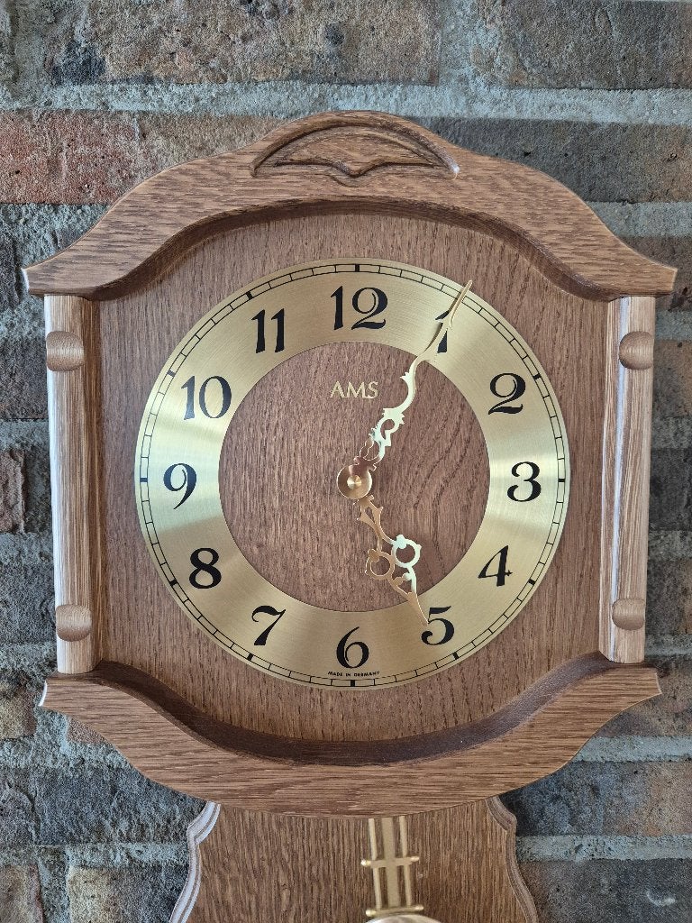 AMS eikenhouten slingerklok, Ophalen