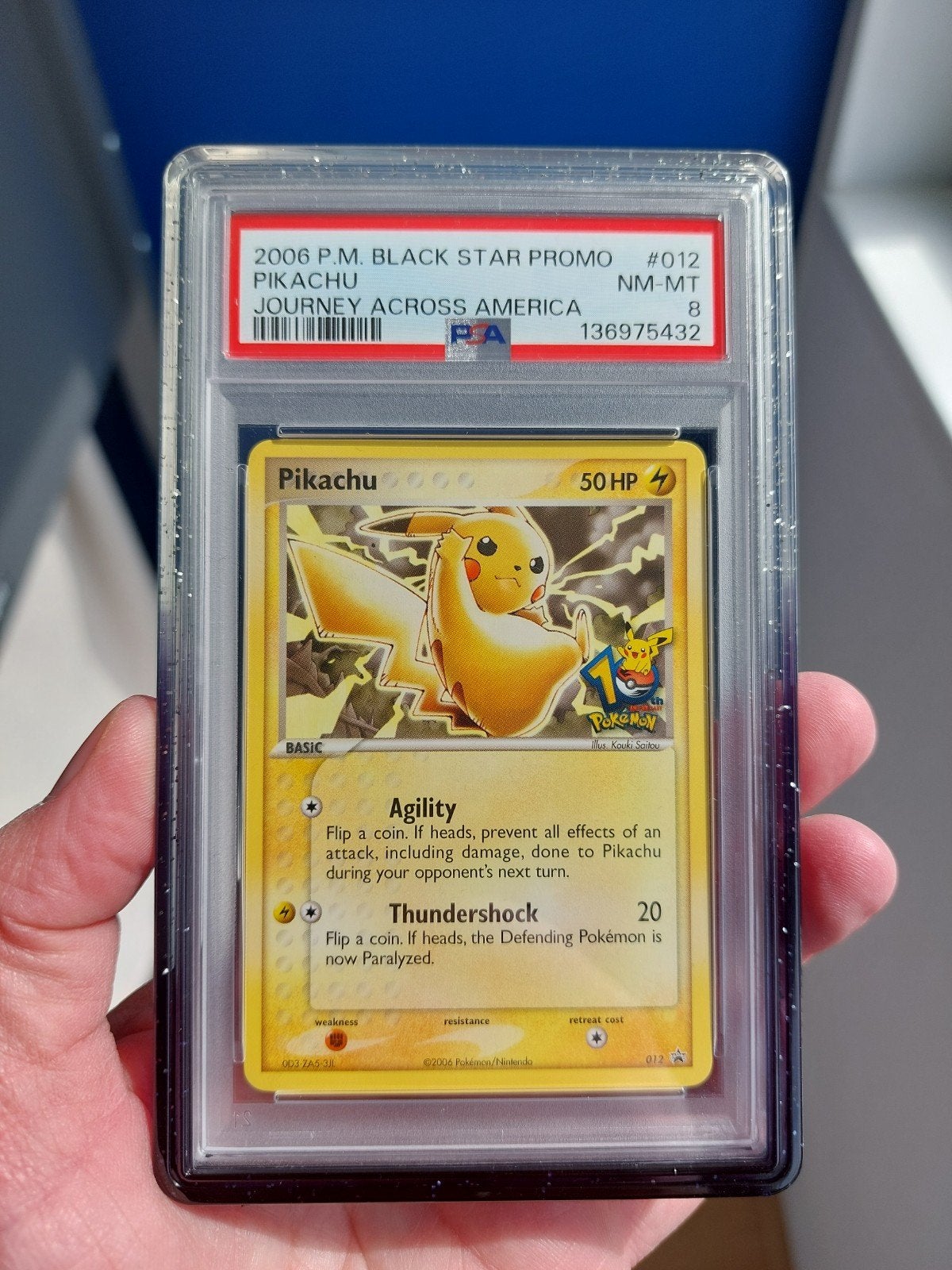 Pikachu 012 (10th anniversary) Journey Across America PSA 8, Ophalen of Verzenden, Zo goed als nieuw
