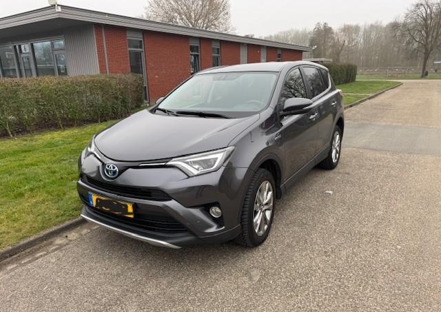 Toyota Rav4 2.5HYBRID 145KW 2WD CVT 2016 2016 Grijs, Auto's, Toyota, Stof, Zwart, 2494 cc, Parkeersensor