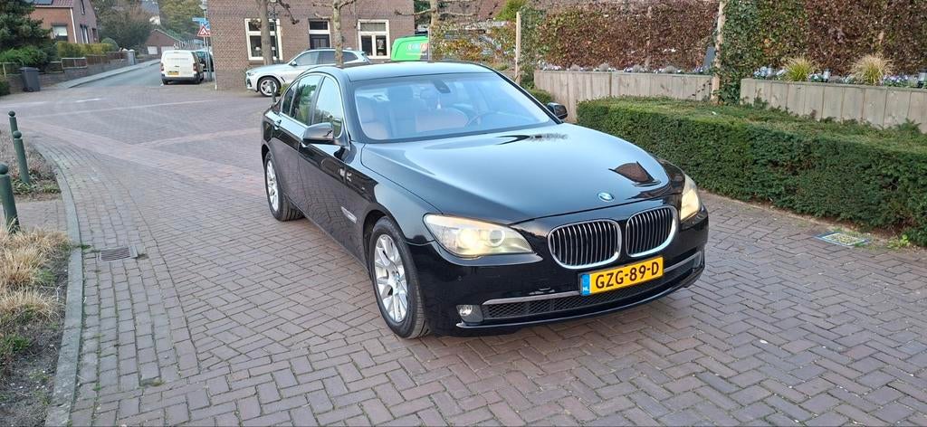 BMW 7-Serie 3.0 I 740 AUT 2009 Zwart, Auto's, BMW, Automaat, Achterwielaandrijving, Beige, USB