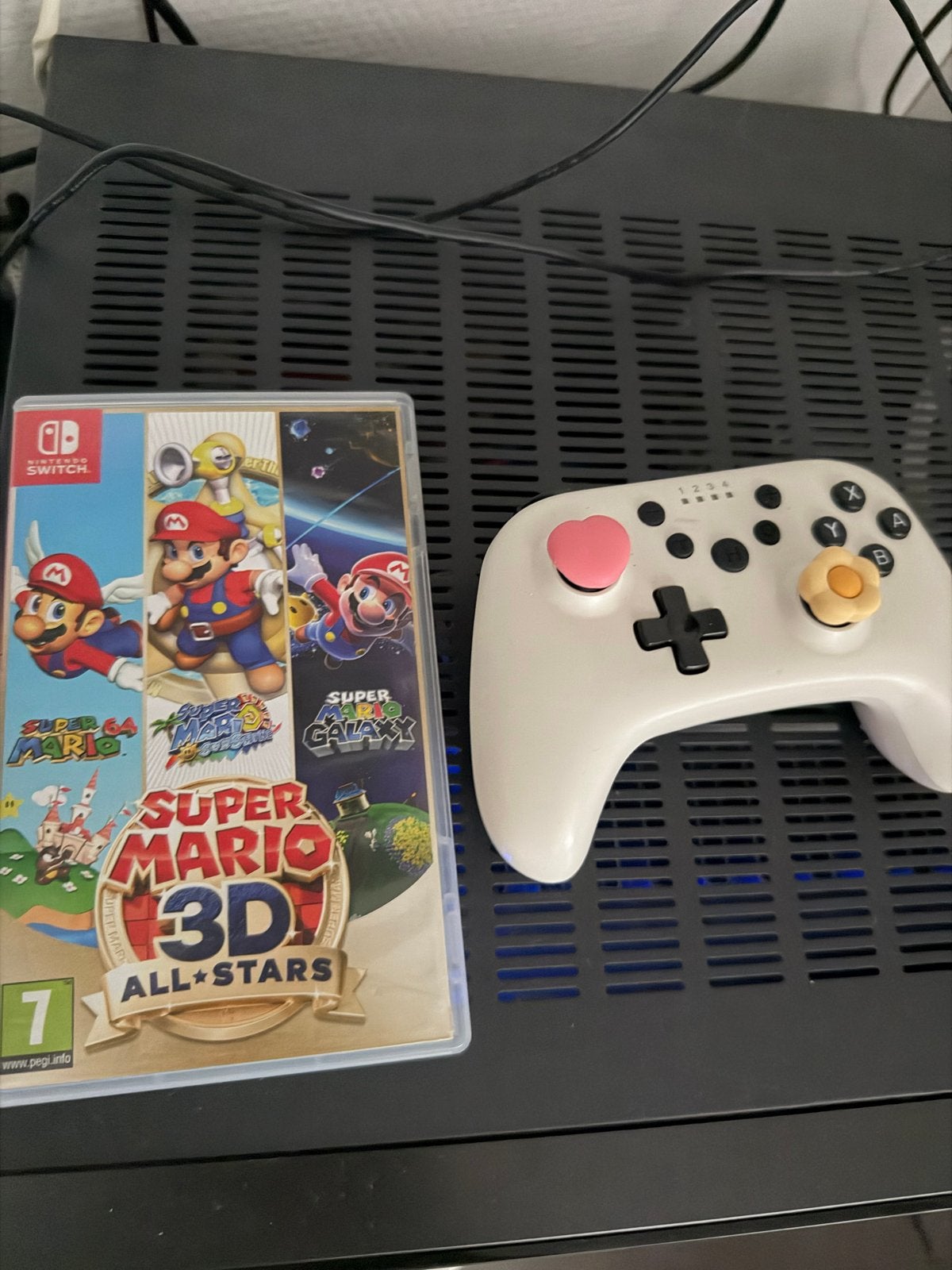 Nintendo Switch OLED met accessoires en Super Mario 3D All-S