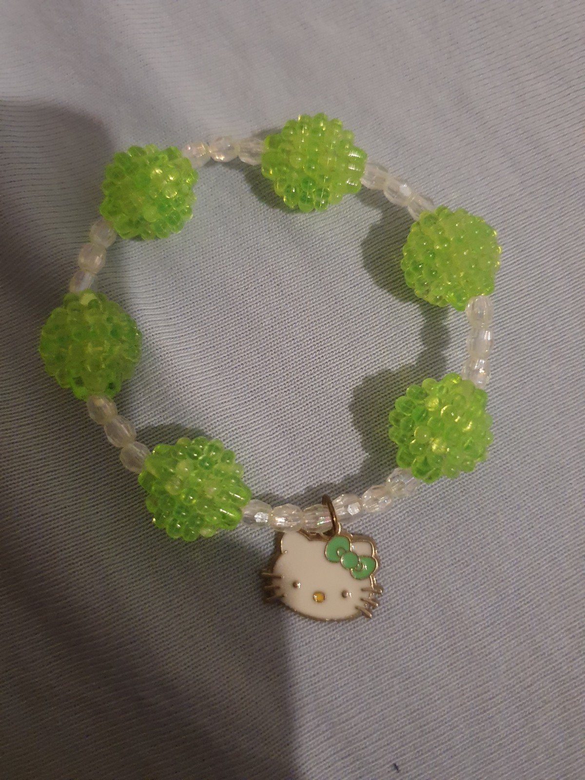 Hello Kitty Armband met Groene Kralen, Kunststof of Plastic, Nieuw, Ophalen of Verzenden, Met bedels of kralen