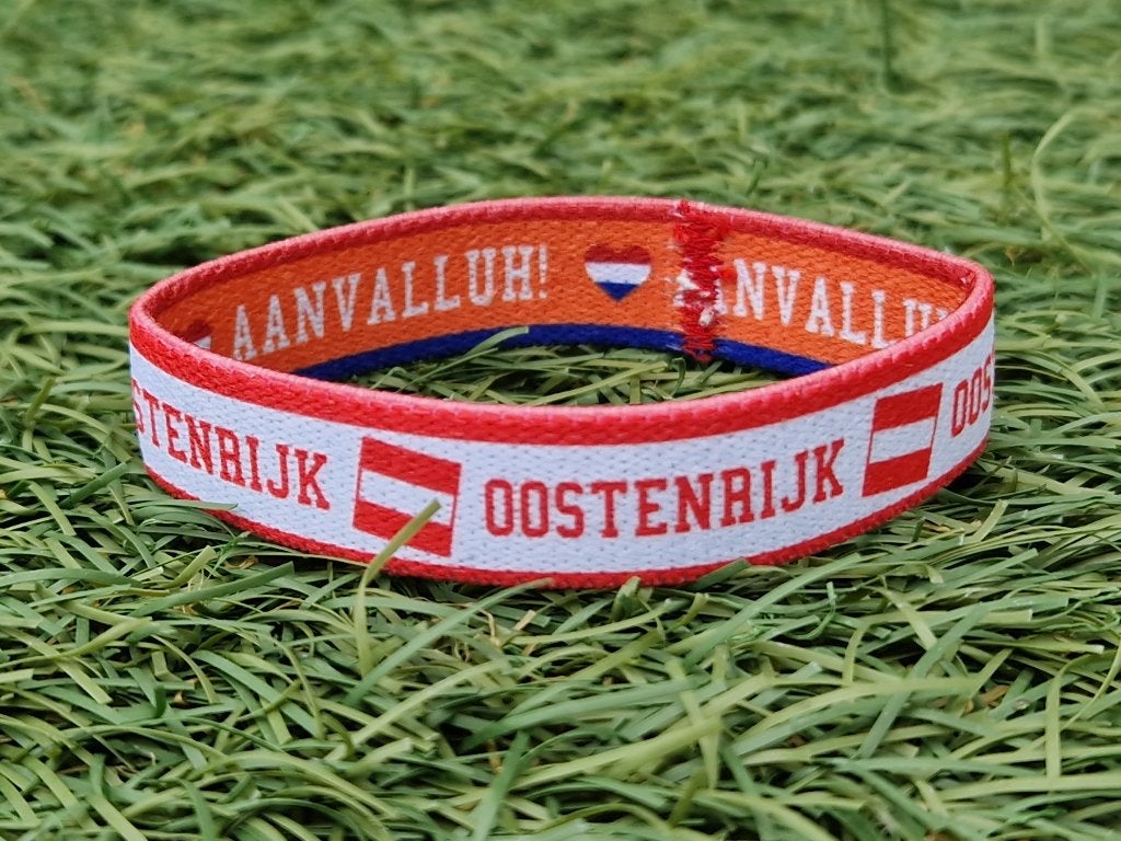 Dubbelzijdig armbandje Oostenrijk / Oranje - WK 2026, Verzenden, Zo goed als nieuw, Buitenlandse clubs, Overige typen
