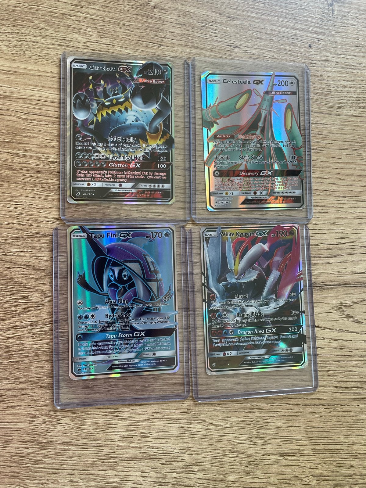4 Pokémon GX kaarten: Guzzlord, Celesteela, Tapu Fini, White, Ophalen of Verzenden, Nieuw, Meerdere kaarten, Foil