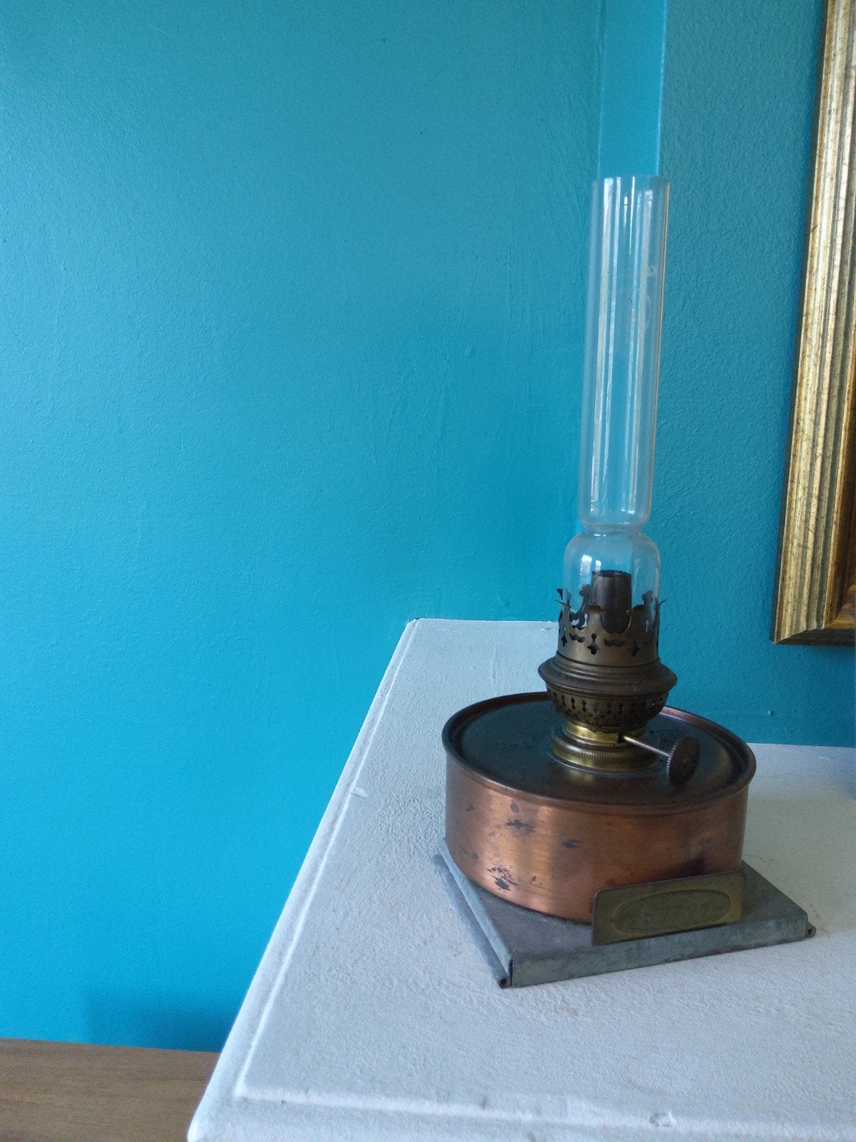 Werkende messing olielamp met lont, Ophalen