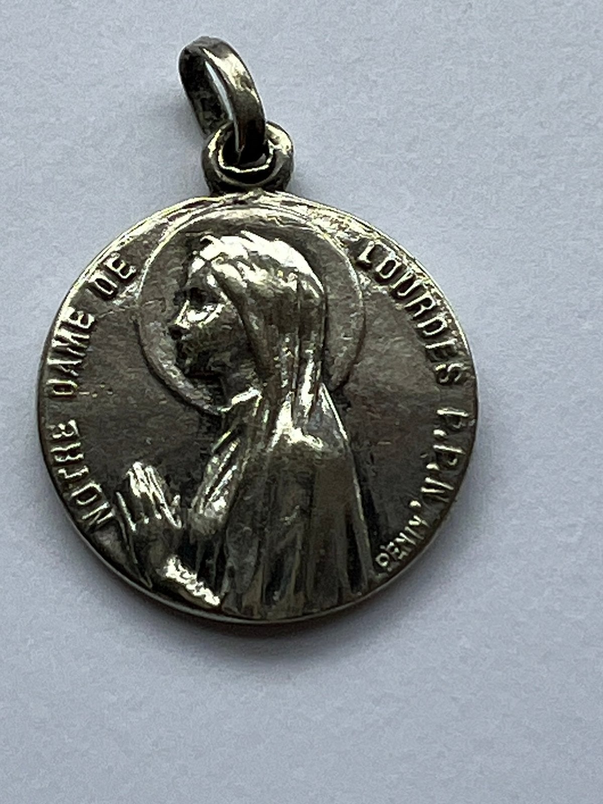 devotiemedaille van Onze-Lieve-Vrouw van Lourdes, Ophalen