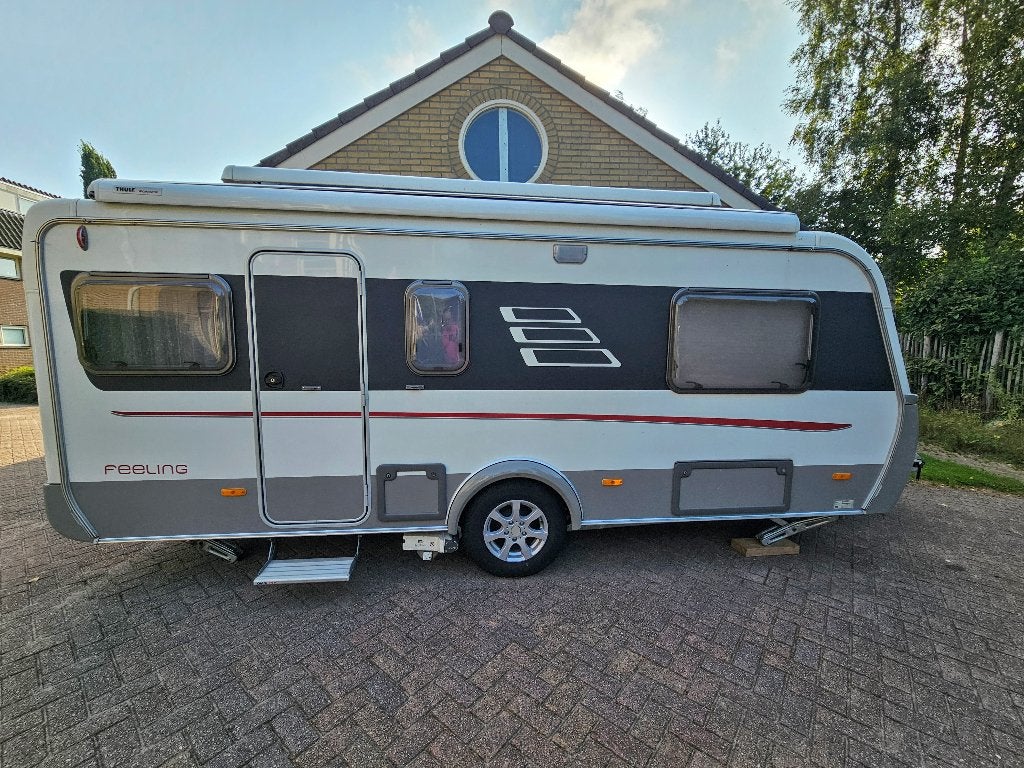 Hymer Eriba Feeling 470 (2011) hefdak, mover, 4 slaap pl., Treinzit, Particulier, Luifel, 4 tot 5 meter