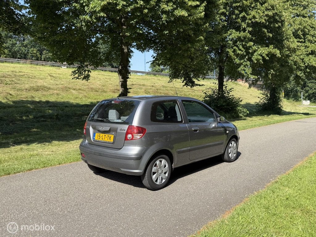 Hyundai Getz 1.3i GLS*NEW APK*AUTOMAAT*NAP*AIRCO*ELEK.RAMEN, Auto's, Hyundai, 4 cilinders, 82 pk, Bedrijf, Grijs
