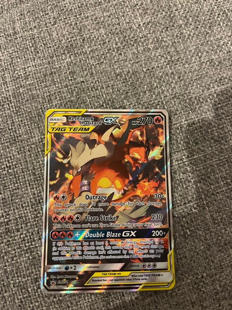Reshiram & Charizard GX #SM201 Pokemon Promo, Ophalen of Verzenden, Zo goed als nieuw