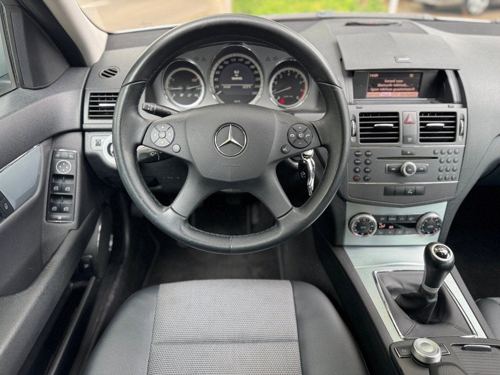 Mercedes-Benz C-klasse 180 Kompressor Business Edition Avant, Auto's, Mercedes-Benz, Gebruikt, Leder en Stof, Handgeschakeld, Sedan