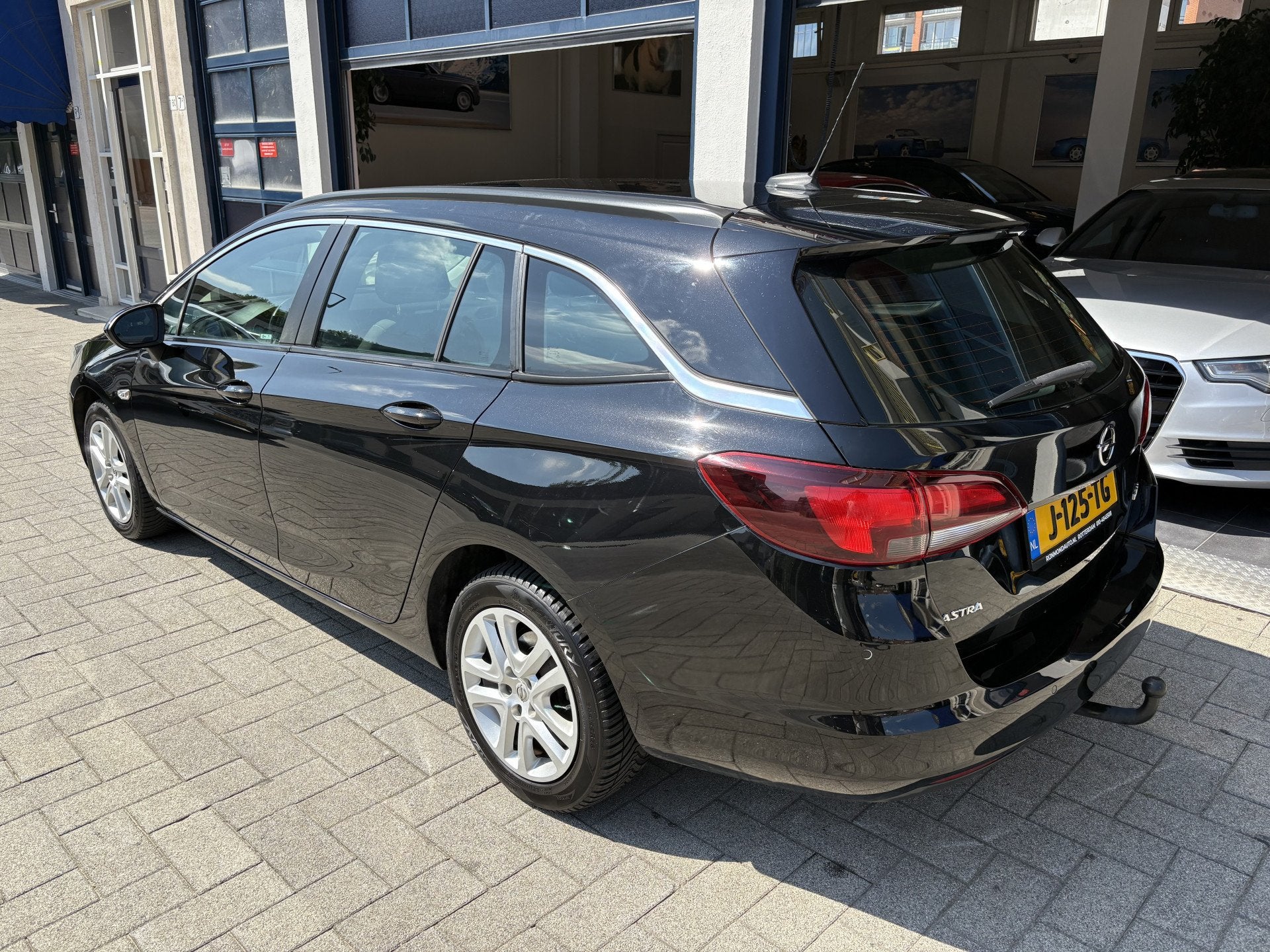 Opel Astra Sports Tourer 1.4 Business Executive AUTOMAAT/AIR, Auto's, Gebruikt, 150 pk, Zwart, 1240 kg