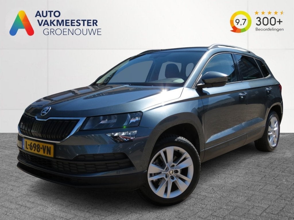 Skoda KAROQ 1.0 TSI115pk AMB. BUS. / Camera / Trekhaak / Car, Auto's, Gebruikt, Euro 6, Met garantie (alle), Karoq