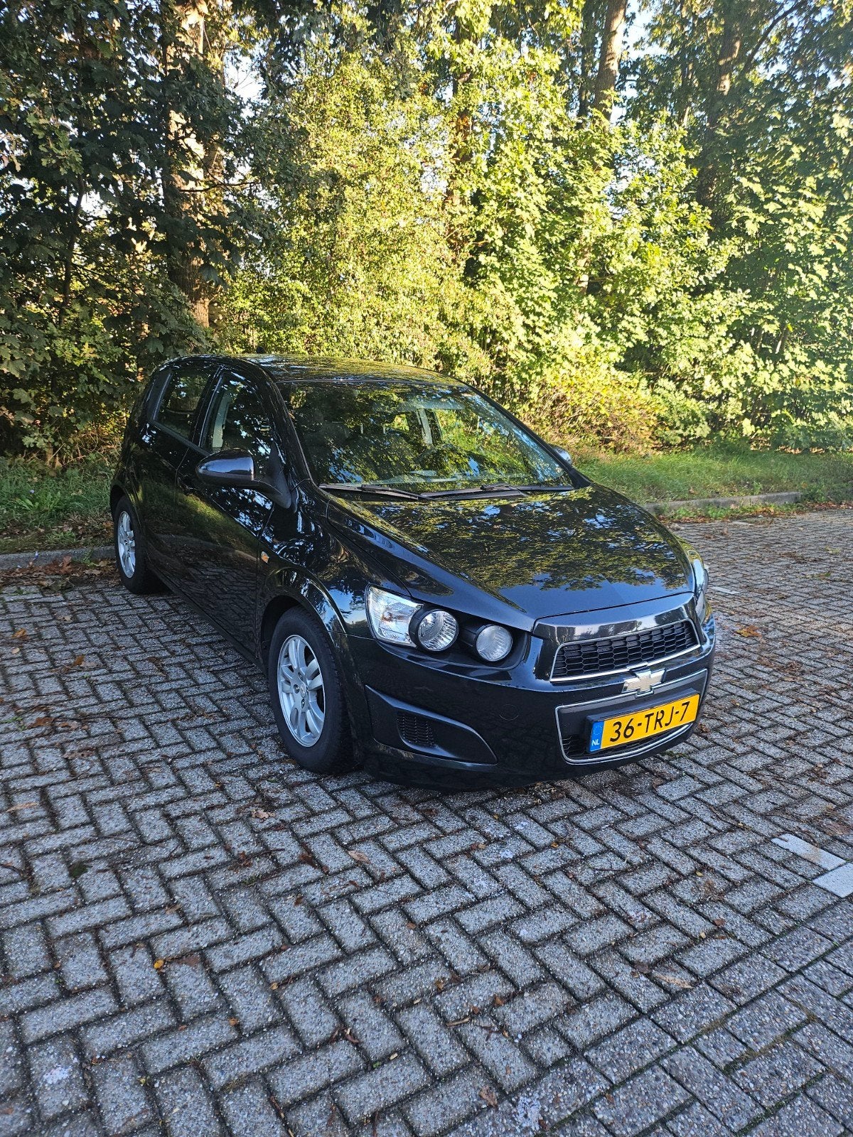 Chevrolet Aveo 1.2 Benzine 2012 133.990km Airco Cruiscontrol, Voorwielaandrijving, 40 €/maand, Aveo, 4 cilinders